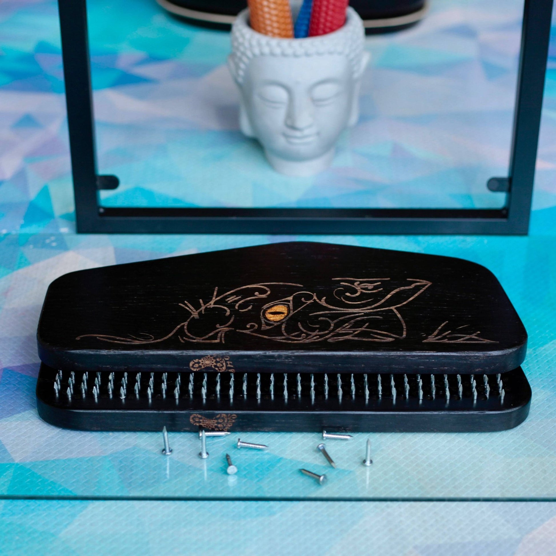 Folded sadhu board with nails, candle holder like buddha