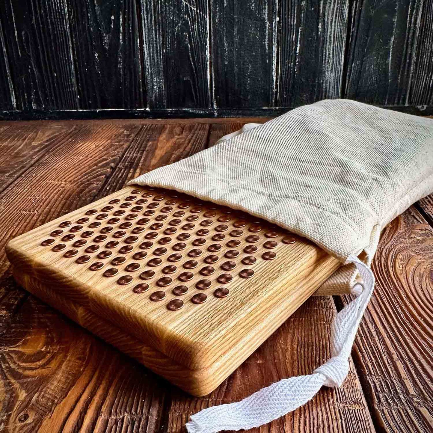 sadhu board with copper nails in white fabric case