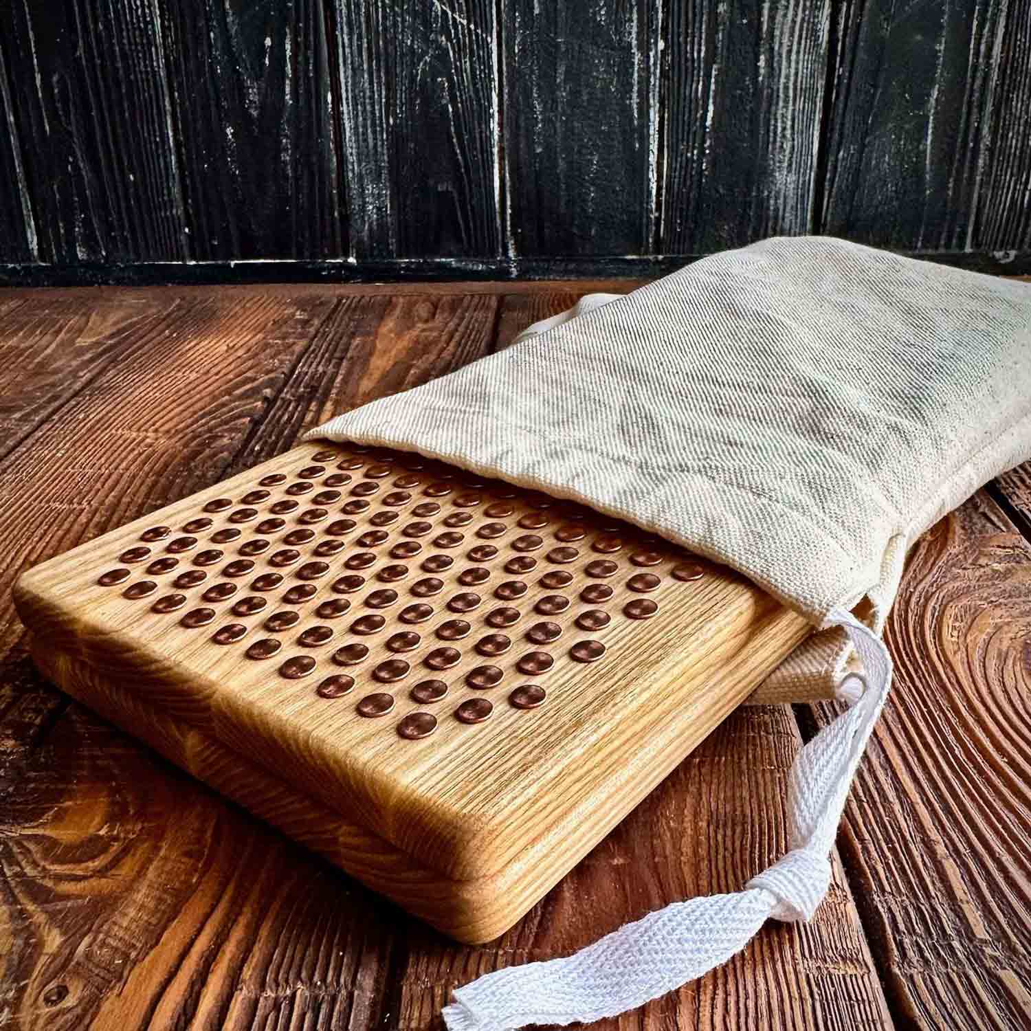 sadhu board with copper nails in white fabric case