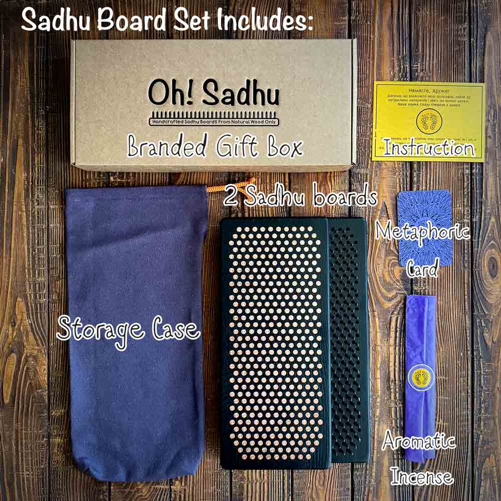 Sadhu Board Set with branded gift box, boards, storage case, card, and incense on a wooden surface.