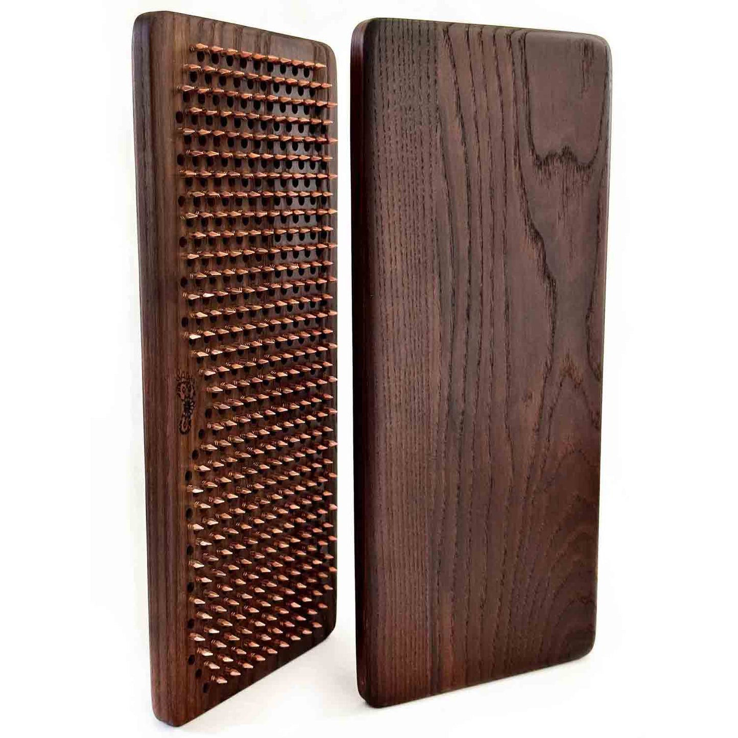 thermo ash wood sadhu board with copper nails on white background