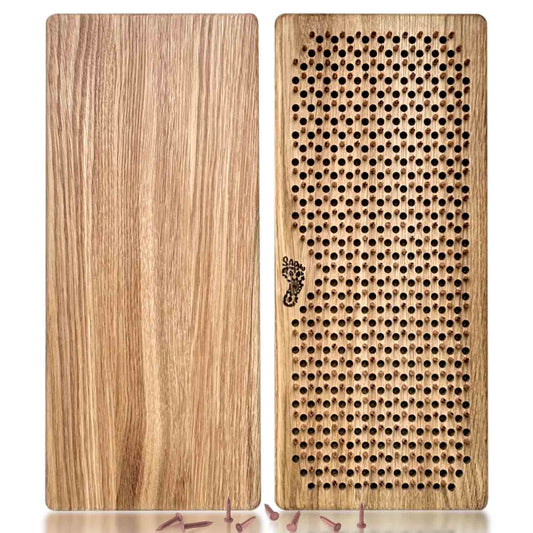 sadhu board with copper nails and natural oak with reflection on white background, some loose copper nails near sadhu boards