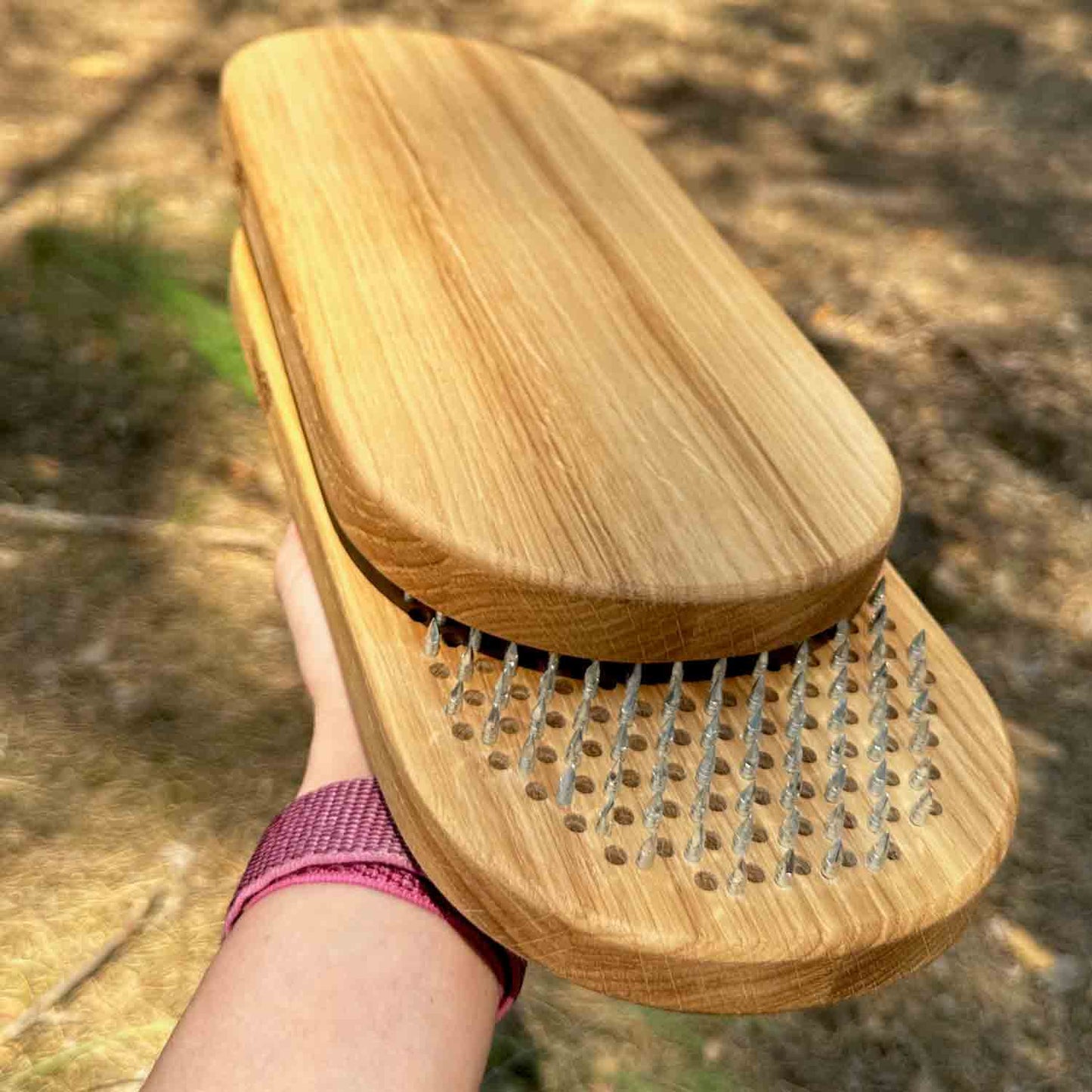 oak wood sadhu board with nails on hand in forest