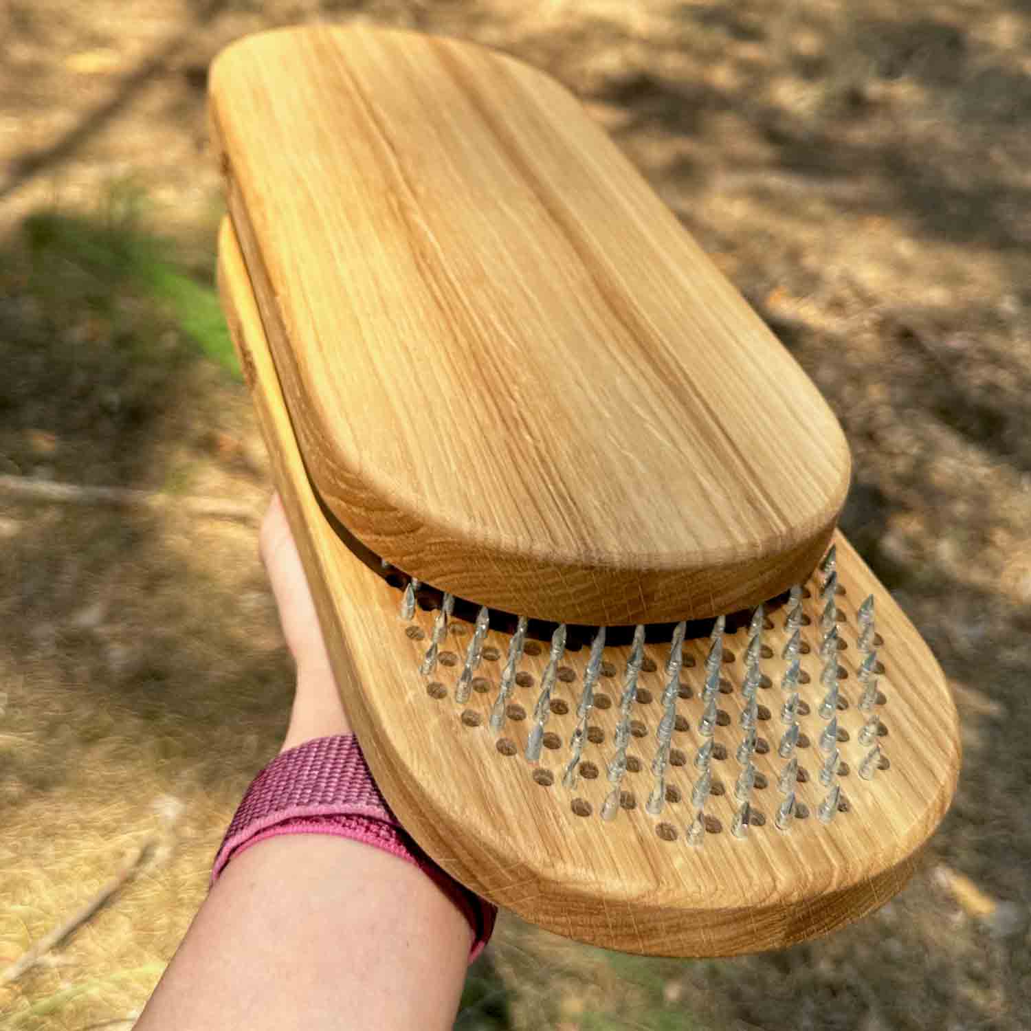 oak wood sadhu board with nails on hand in forest