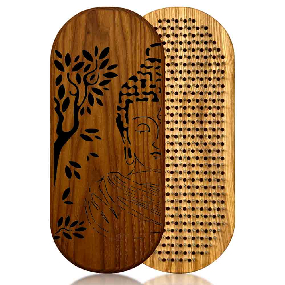 Sadhu board with nails for feet from ash and thermo ash with Buddha and tree engraving on a white background.