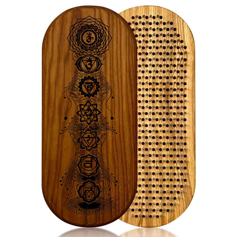sadhu board from ash and thermo ash with chakras engraving on a white background.