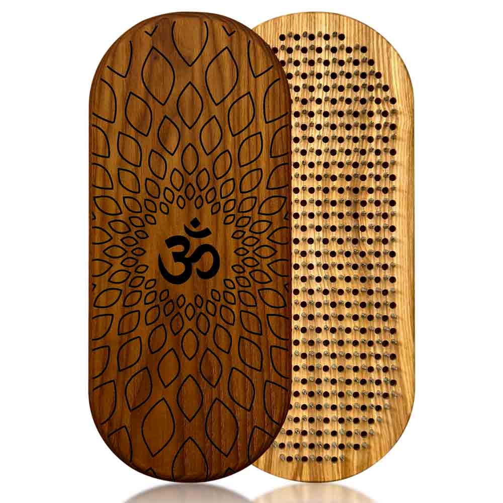 sadhu board from ash and thermo ash with aum engraving on a white background.