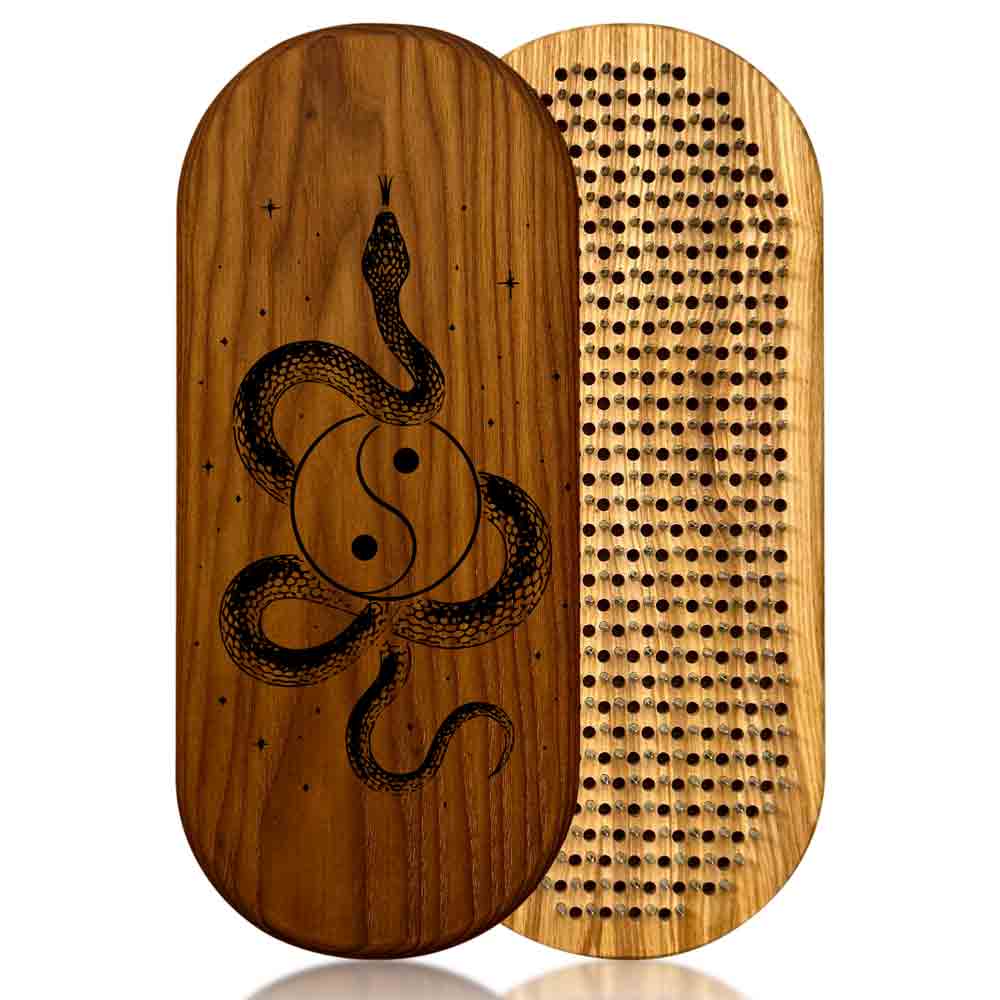 Sadhu board with snake and yin-yang design on one side and textured pattern on the other, on a white background.