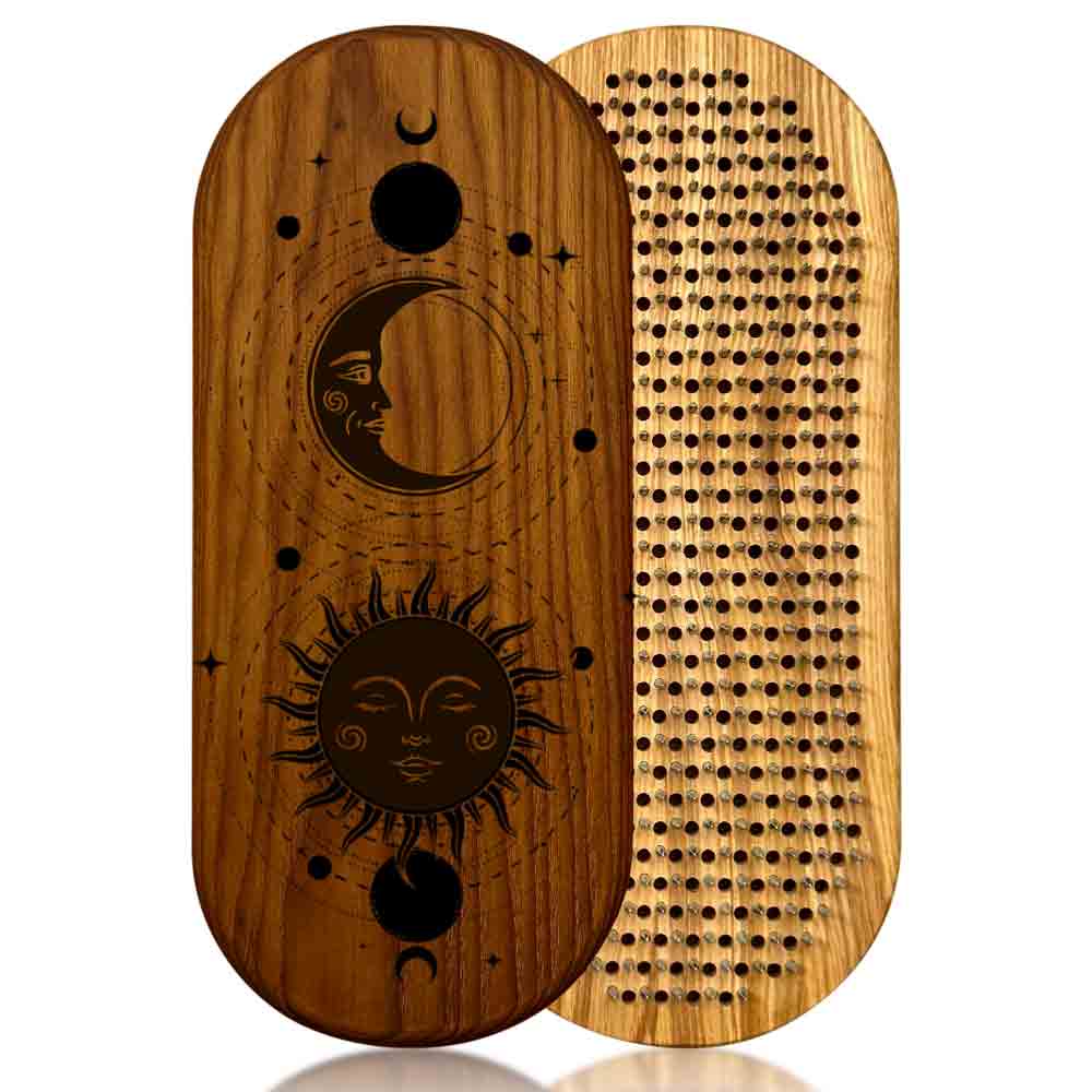 Wooden sadhu nail board with engraved sun and moon design on one side and nails side on the other, on a white background.