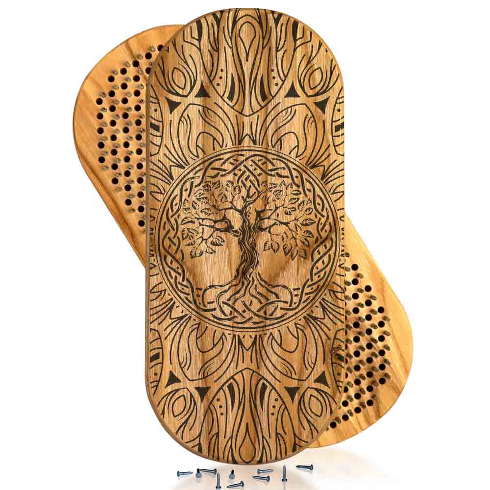 Wooden acupuncture massage boards with tree of life design on a white background