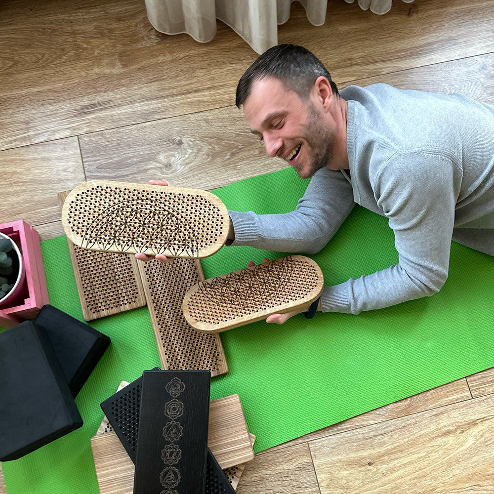 Man feeling happy after standing on Oh! Sadhu board nails