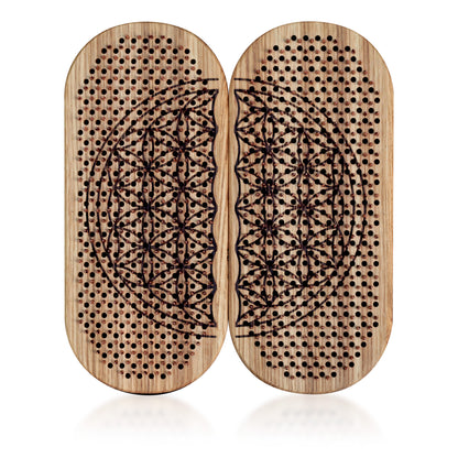 wooden board with copper nails and flower of life engraving