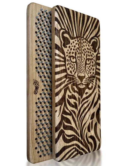 A wooden foot massage board nails with a laser-engraved cheetah design on the front and a textured side showing rows of nails for feet, set against a plain white background.
