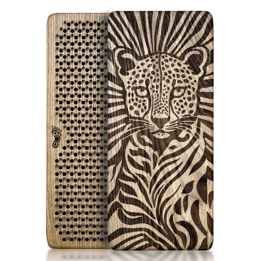 A rectangular oak wood Sadhu board featuring a detailed laser-engraved cheetah on one side and a Flower of Life nails pattern on the other.