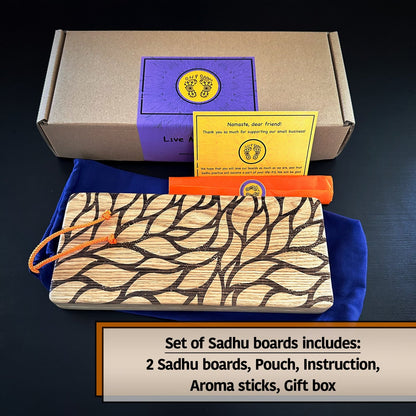 Grey boz with violet sticker with feet on it and Oh! Sadhu brand, yellow instruction, orange pack with aroma stick, sadhu board with leaves engraving, violet pouch