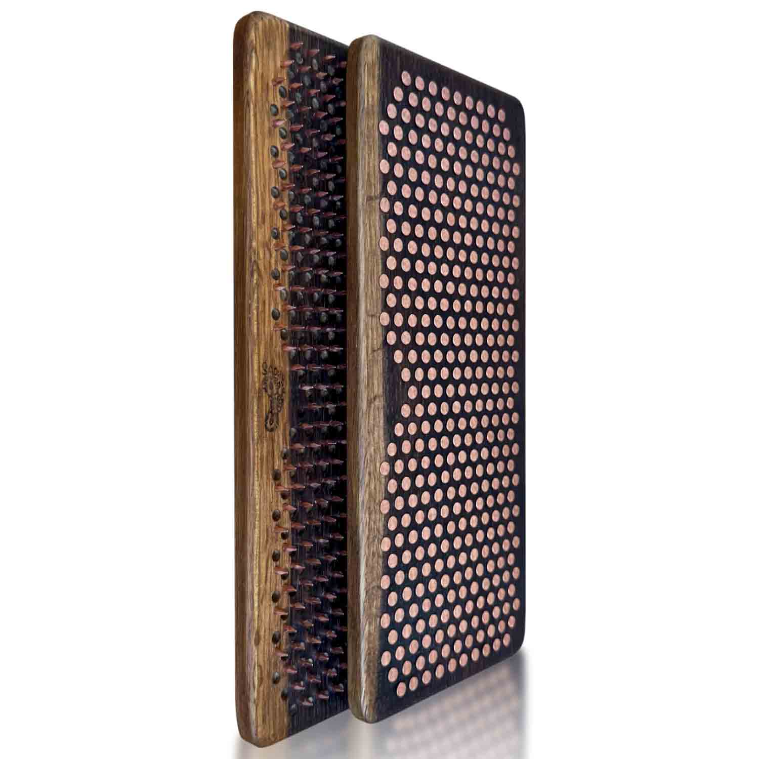 Fumed oak sadhu boards with copper nails in a black brown natural color shown on a white background.