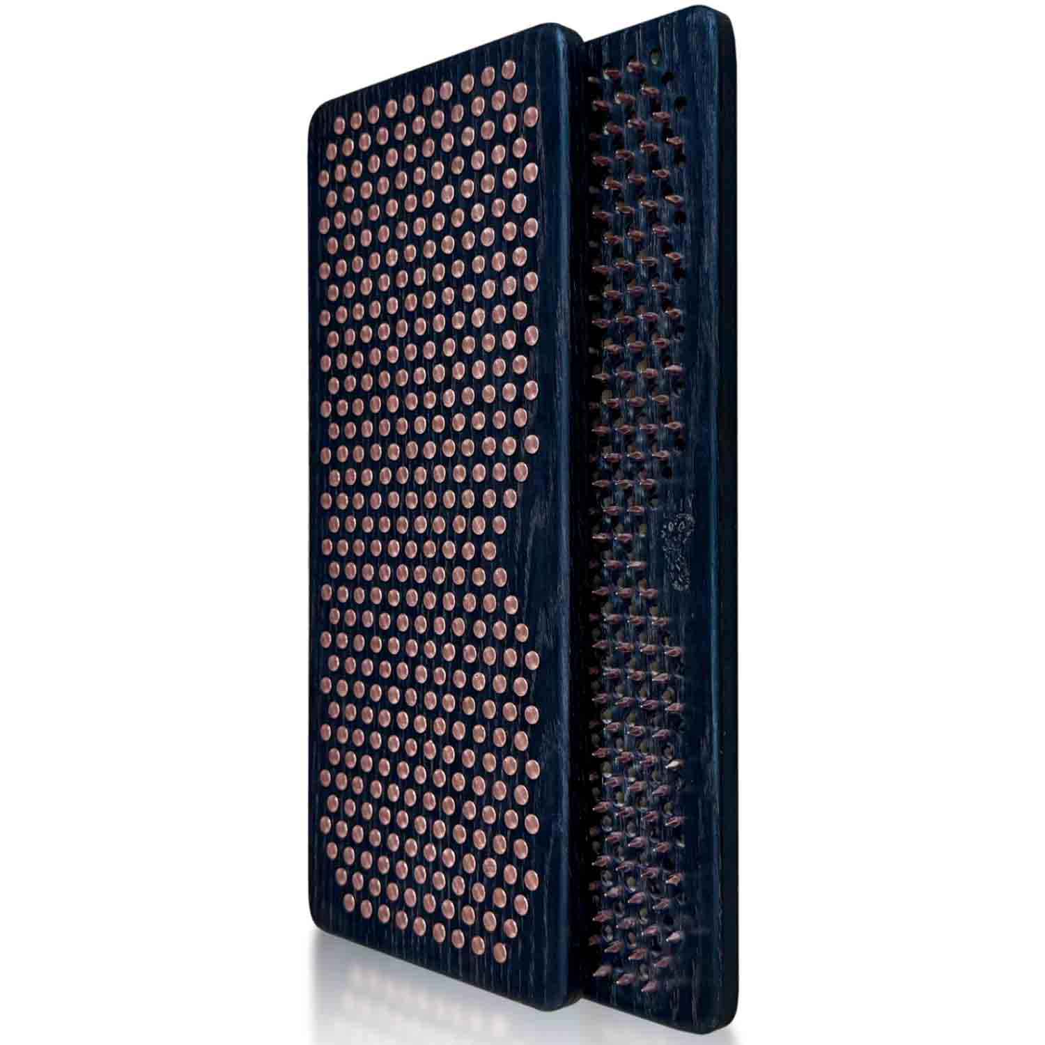 Two black Sadhu boards with copper nails on a white background