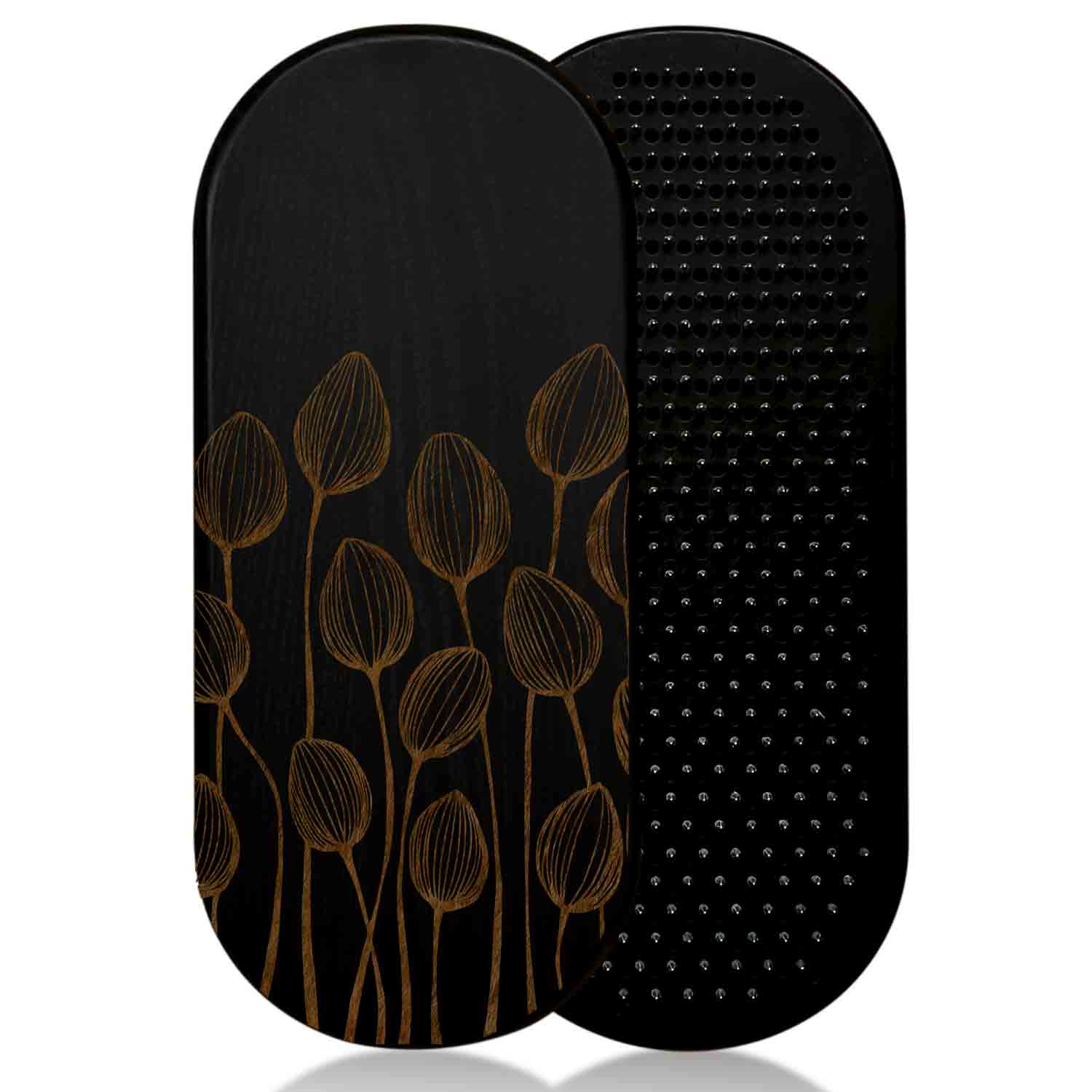 Black ash wood sadhu board with floral design on one and nails surface on the other, on a white background.