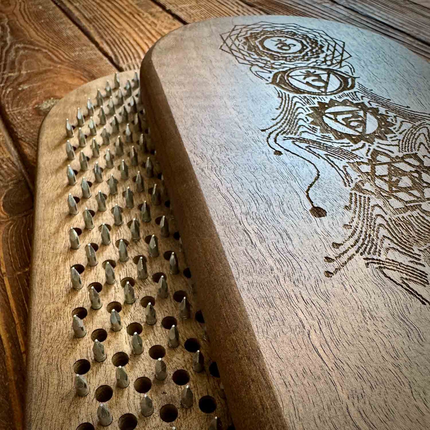 sadhu board with nails for feet for yoga practice and meditation made from walnut tree. 