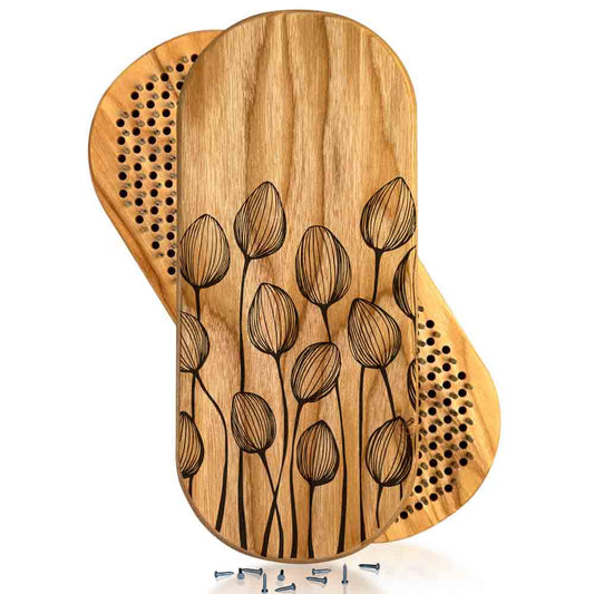 Wooden sadhu board for yoga with engraved floral design on a white background