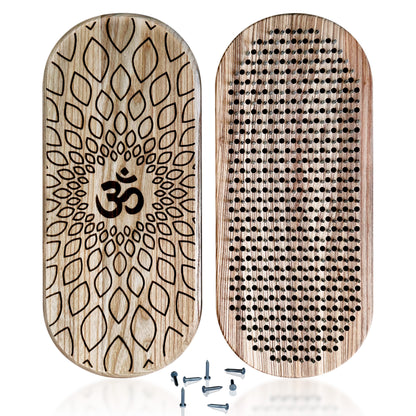 Sadhu board made from natural ash wood featuring an engraved Om symbol. The board has galvanized nails arranged in the Flower of Life pattern, with some nails placed nearby.