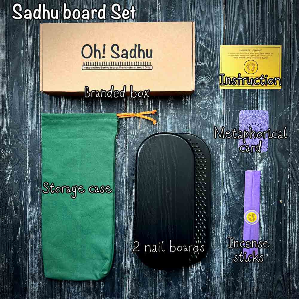 Sadhu board set with branded box, storage case, nail boards, and incense sticks on a wooden surface.