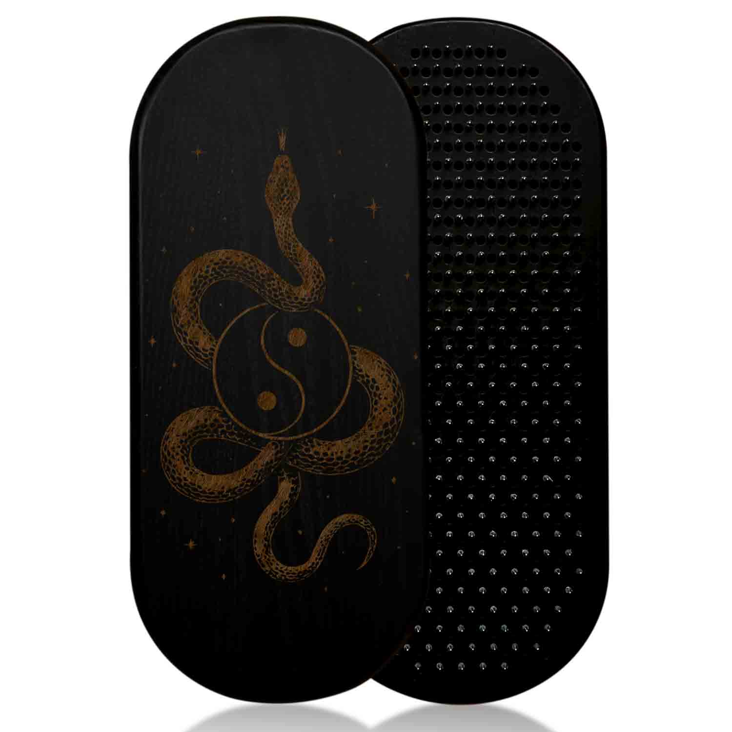 Black sadhu board with a snake and yin-yang design on a white background