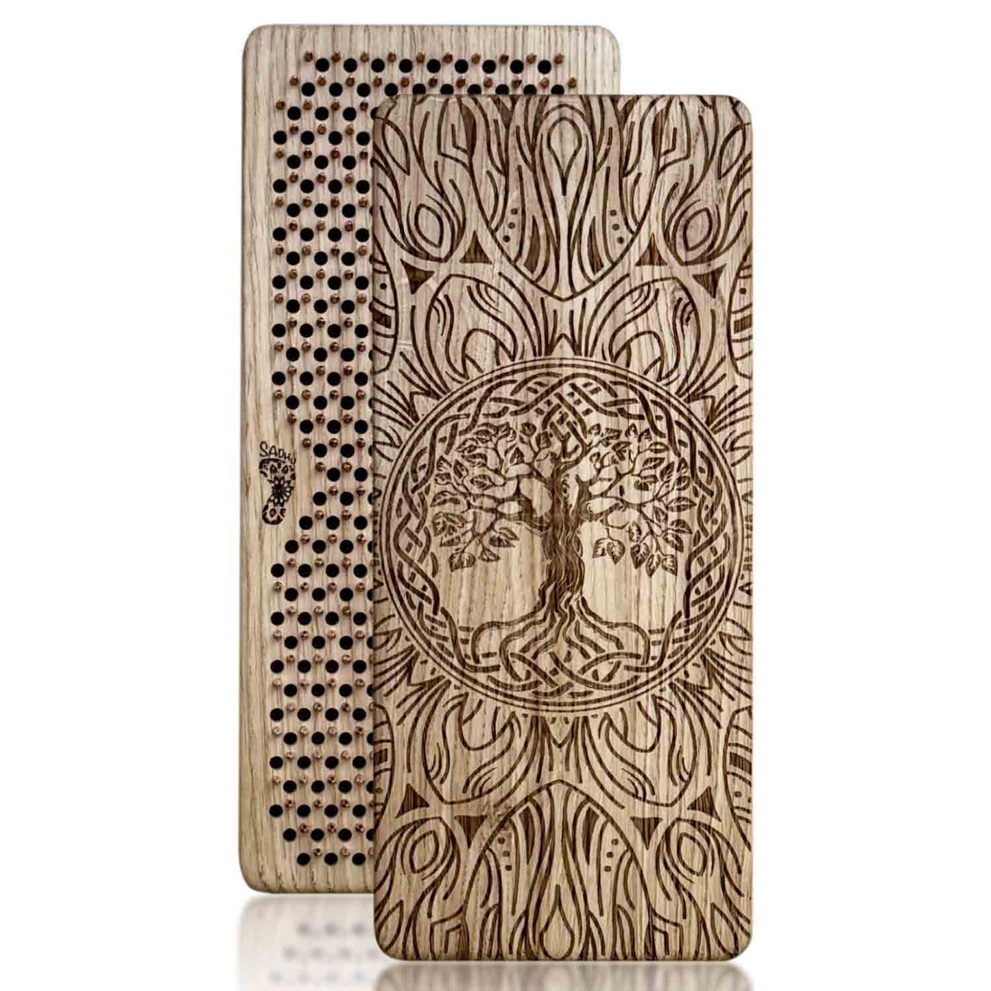 Two oak wood sadhu boards with copper nails with tree of life design on a white background