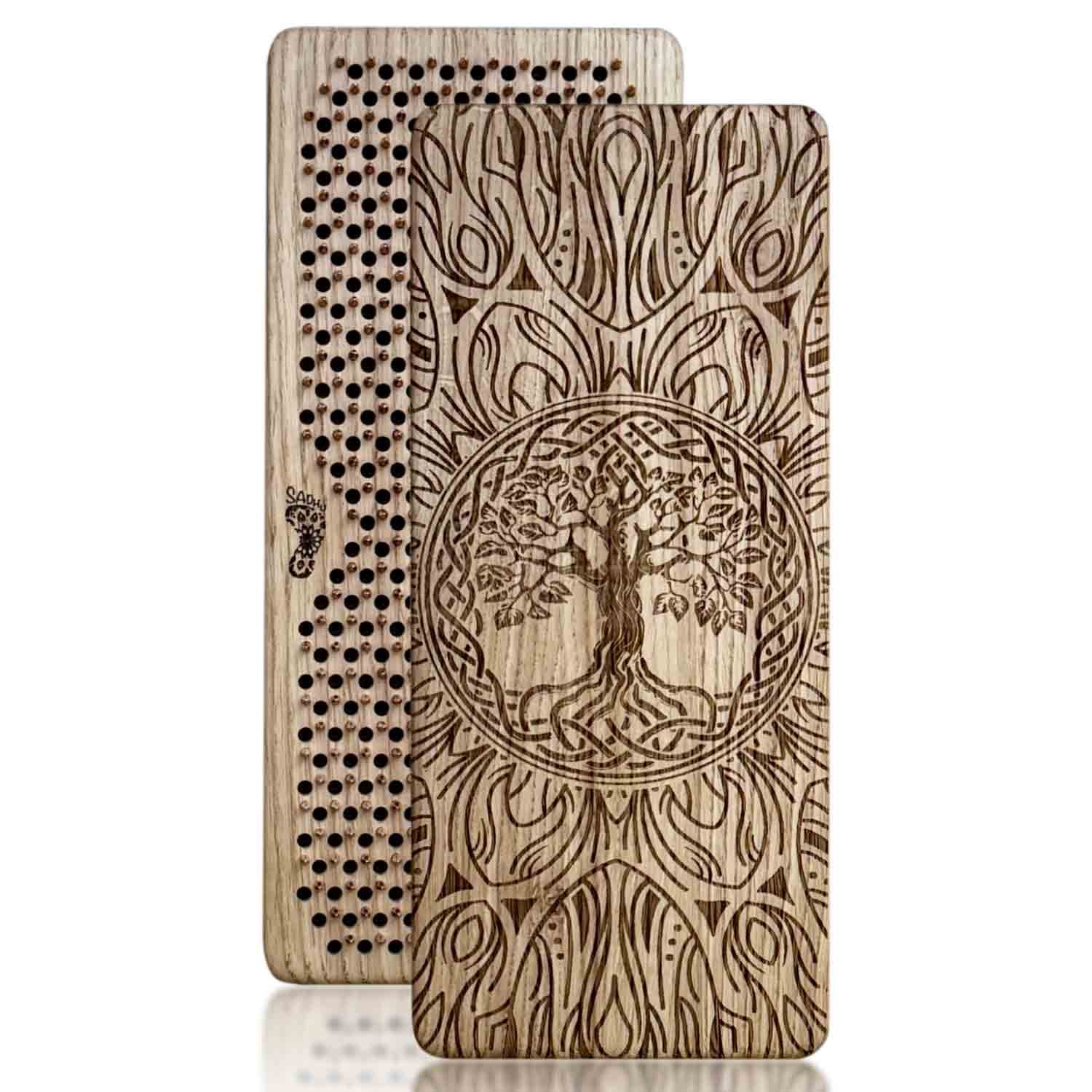 Two oak wood sadhu boards with copper nails with tree of life design on a white background