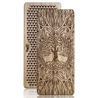 Two oak wood sadhu boards with copper nails with tree of life design on a white background
