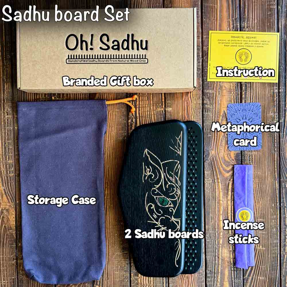 Sadhu board set with branded gift box, storage case, two Sadhu boards, a metaphorical card, and incense sticks on a wooden surface.