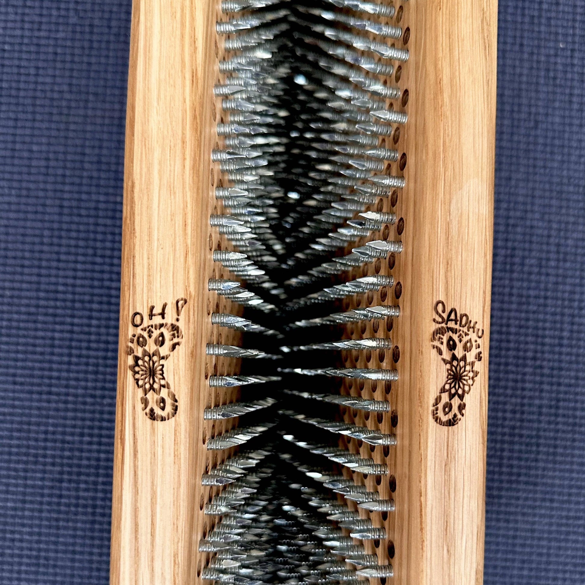 logo on oak wood sadhu board with nails