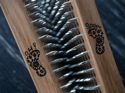 nails in board with engraving logo of foot