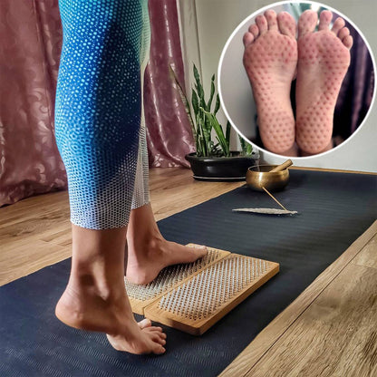Yoga girl stand on nails wooden sadhu board. feet after standing on nails